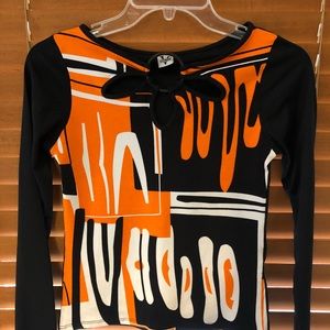 Bright colored black and orange long sleeve shirt.